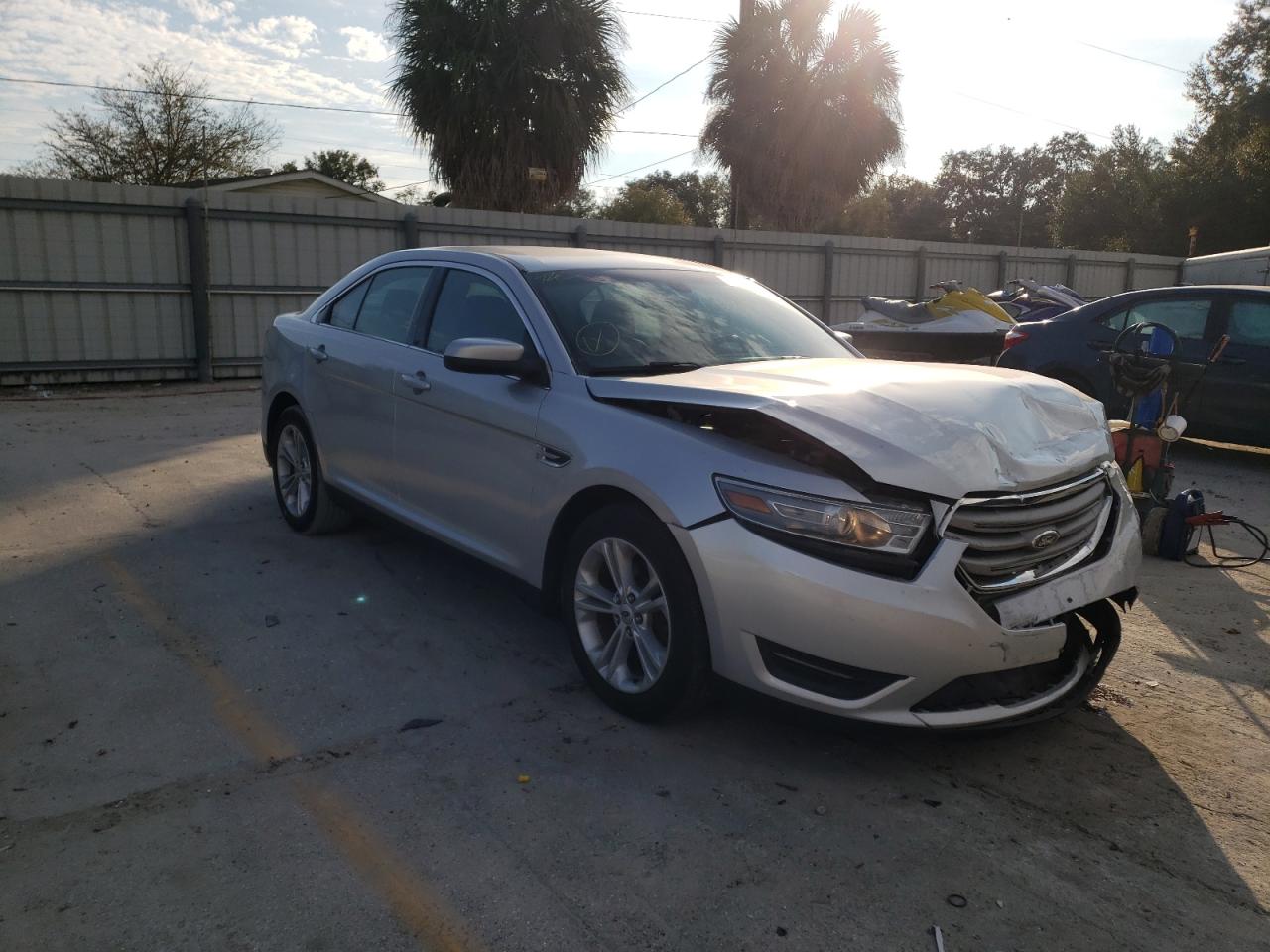 FORD TAURUS SEL 2013 with VIN 1FAHP2E8XDG174296 - Photo from auction