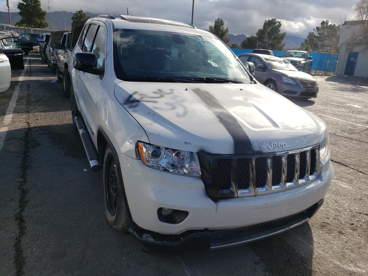 JEEP GRAND CHER 2011 with VIN 1J4RR6GT5BC606695 - Photo from auction