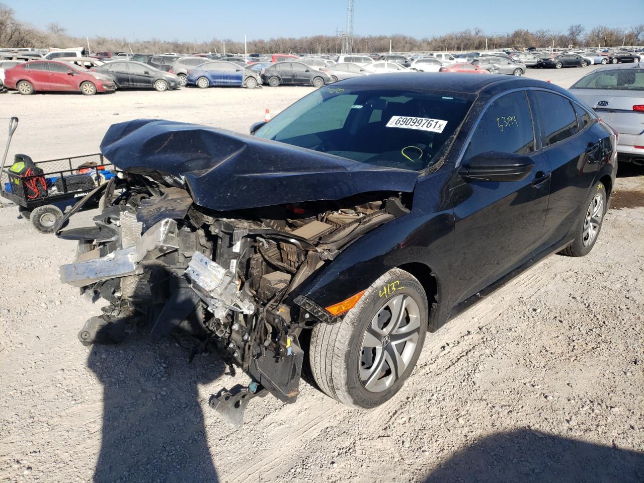 Photo 2 from auction – 2018 HONDA CIVIC LX with VIN 19XFC2F57JE013580