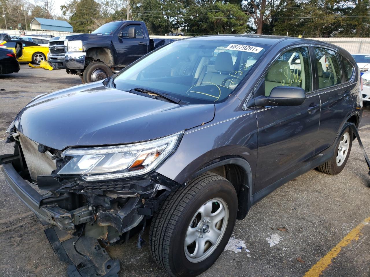 Photo 2 from auction – 2015 HONDA CR-V LX with VIN 5J6RM4H32FL131028