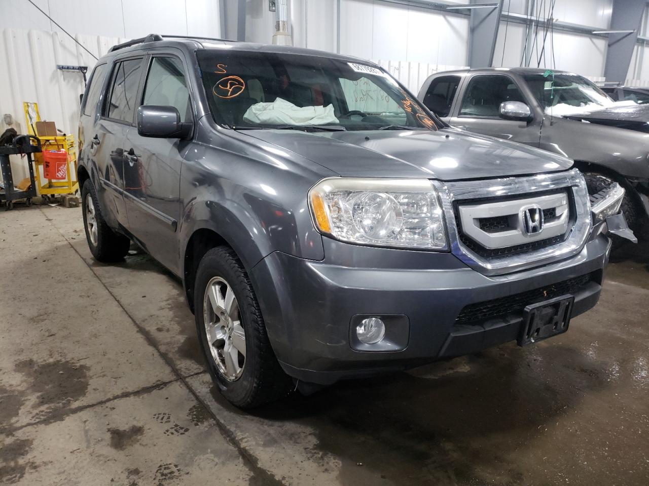 HONDA PILOT EXL 2011 with VIN 5FNYF4H59BB090973 - Photo from auction