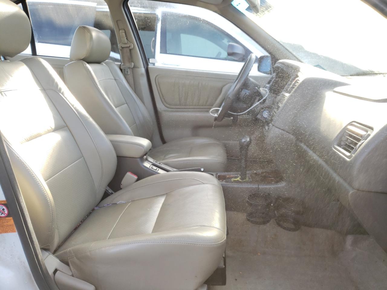 Photo 5 from auction – 2002 INFINITI G20 with VIN JNKCP11A72T507838