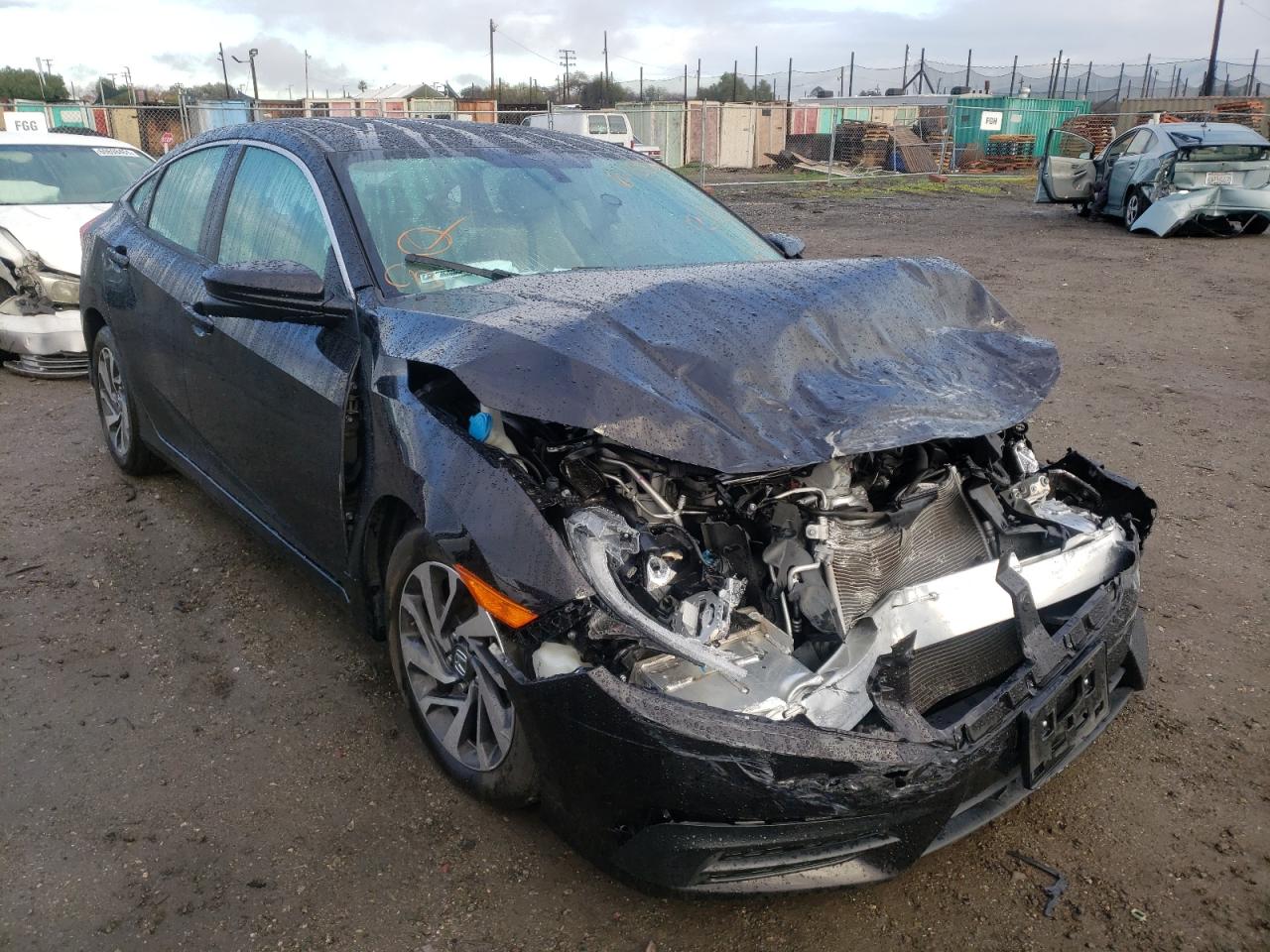 HONDA CIVIC EX 2018 with VIN 19XFC2F76JE201430 - Photo from auction