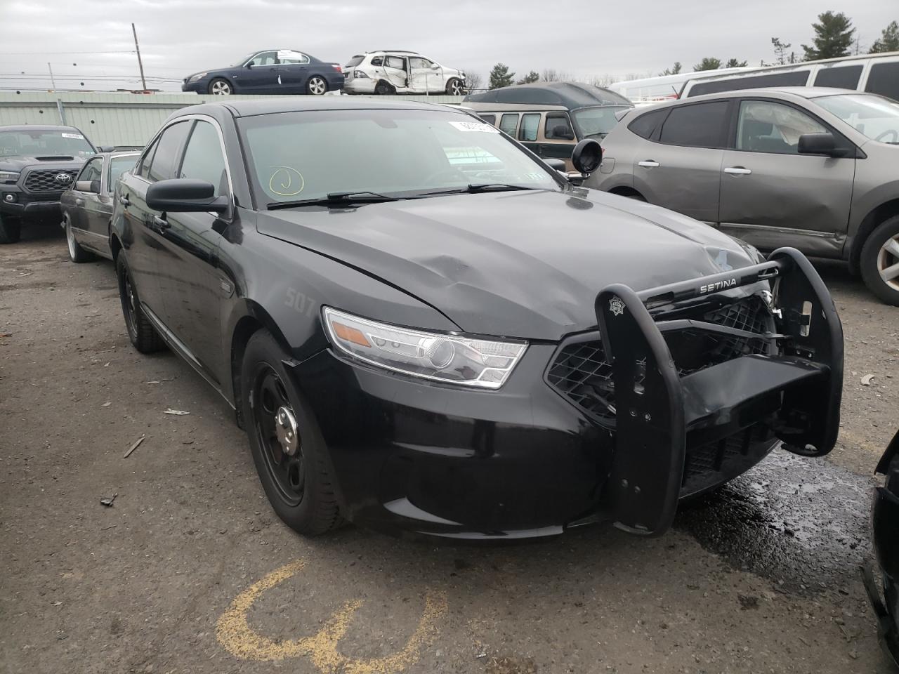 FORD TAURUS POL 2014 with VIN 1FAHP2MK2EG125950 - Photo from auction