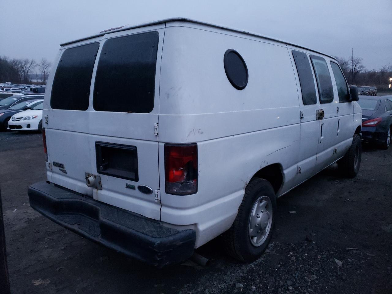 Photo 4 from auction – 2011 FORD E-150 VAN with VIN 1FTNE1EW1BDA74517