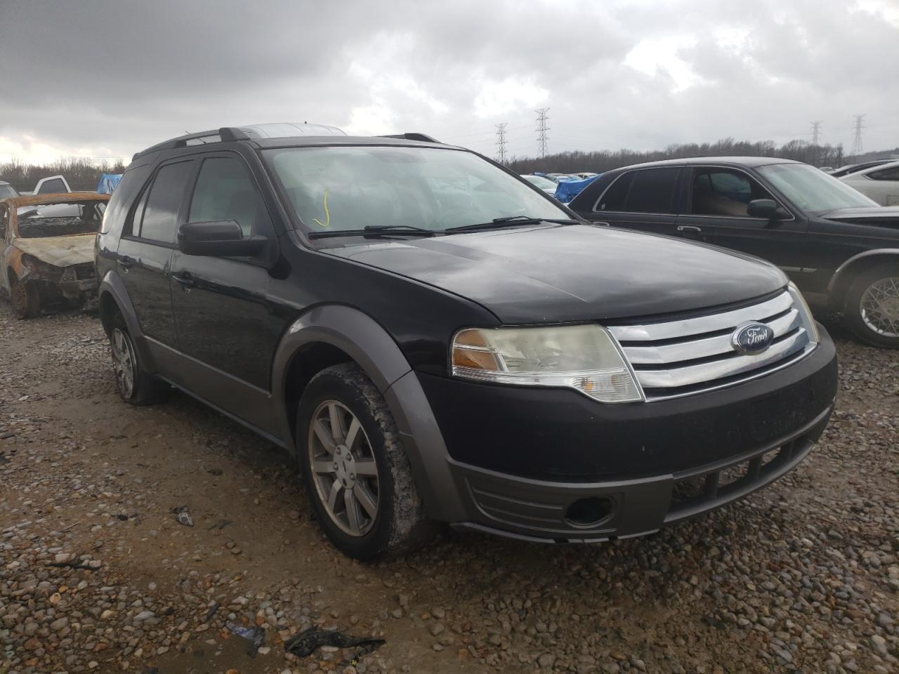 FORD TAURUS X S 2009 with VIN 1FMDK02W39GA02614 - Photo from auction