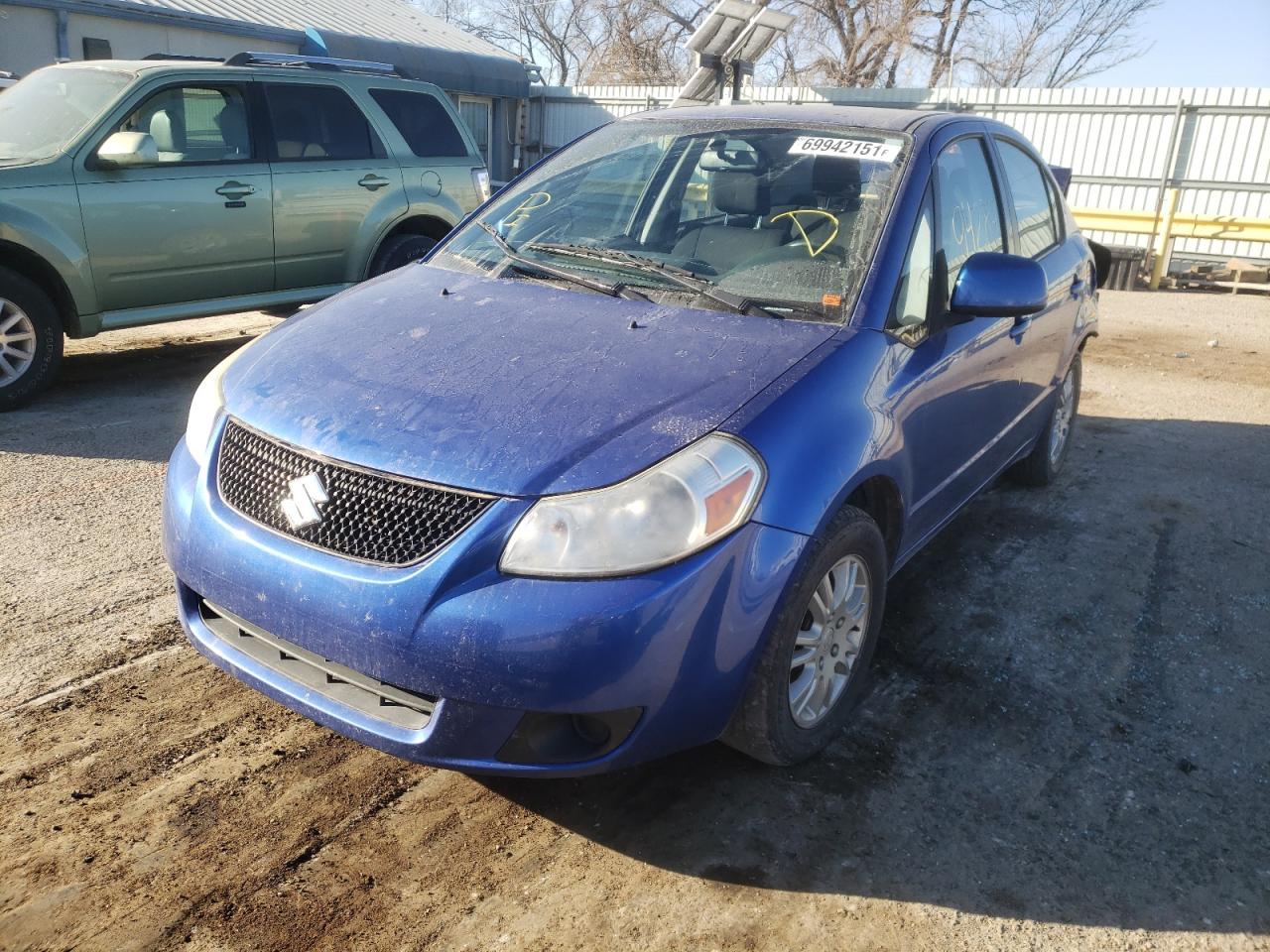 Photo 2 from auction – 2013 SUZUKI SX4 LE with VIN JS2YC5A3XD6100566