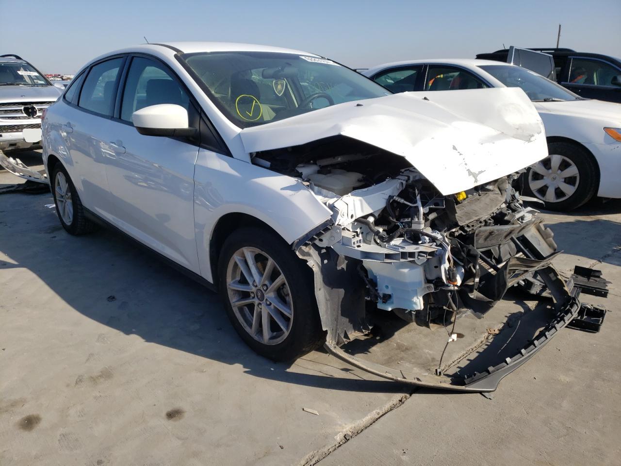 FORD FOCUS SE 2018 con VIN 1FADP3FE6JL210612 - Foto de la subasta
