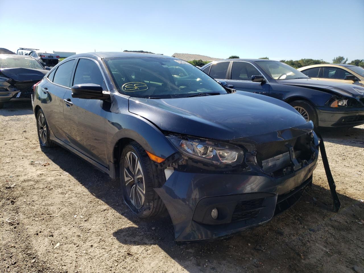 HONDA CIVIC EX 2018 with VIN JHMFC1F36JX032225 - Photo from auction