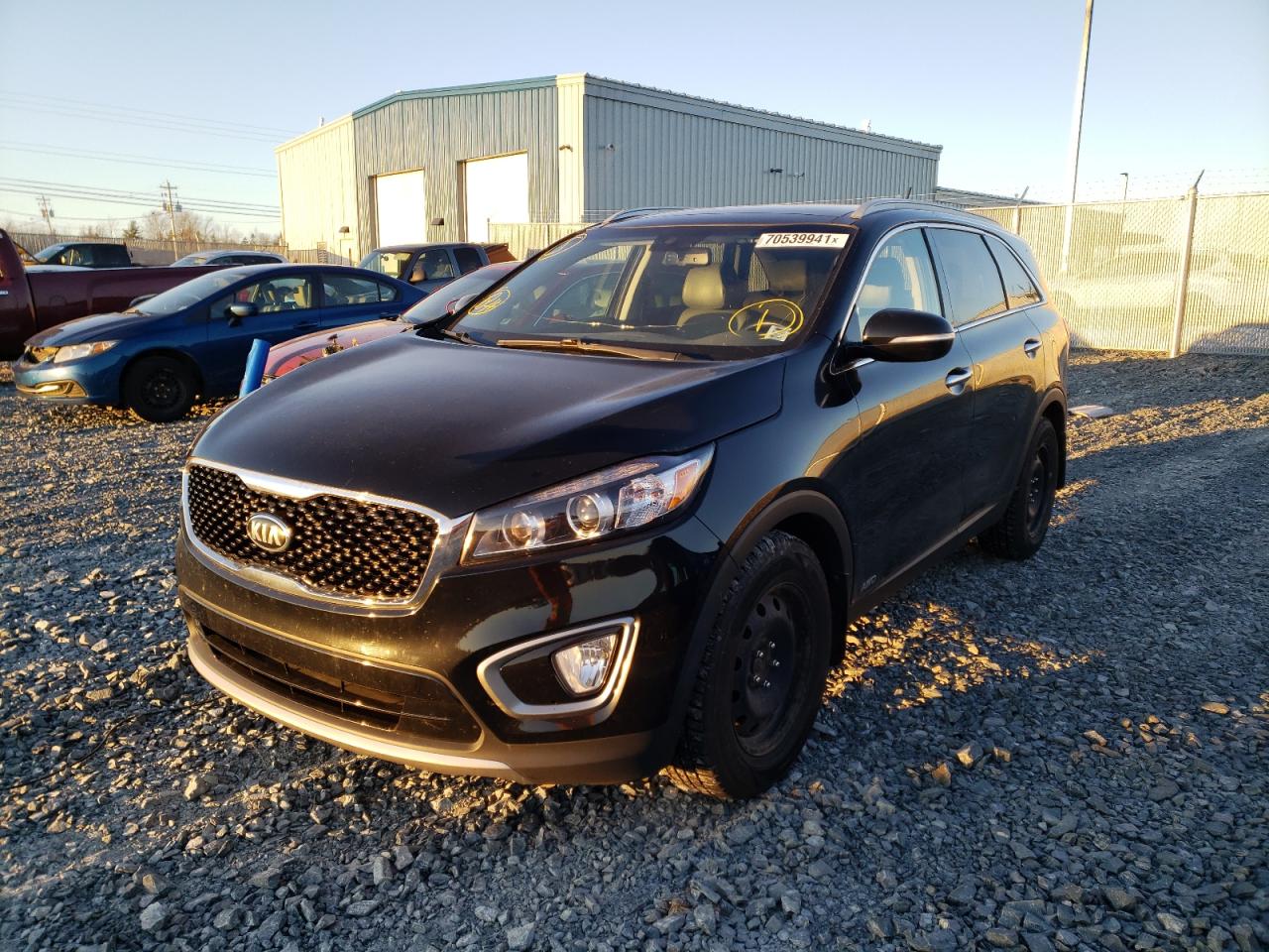 Photo 2 from auction – 2016 KIA SORENTO EX with VIN 5XYPHDA52GG091107