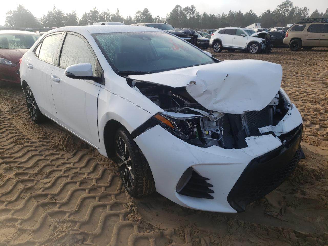 TOYOTA COROLLA L 2018 with VIN 5YFBURHE6JP831012 - Photo from auction