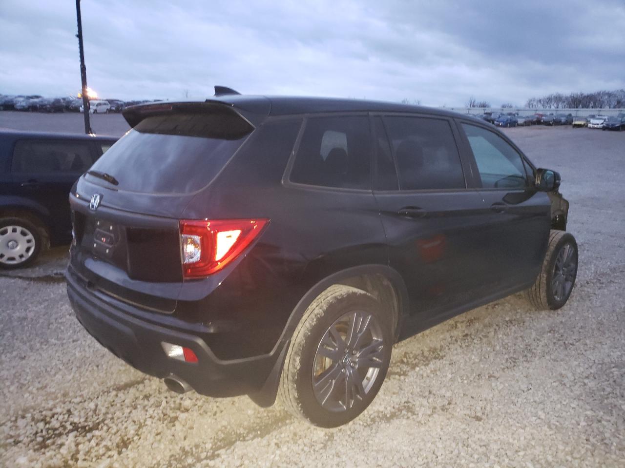 Photo 4 from auction – 2019 HONDA PASSPORT E with VIN 5FNYF7H56KB005637