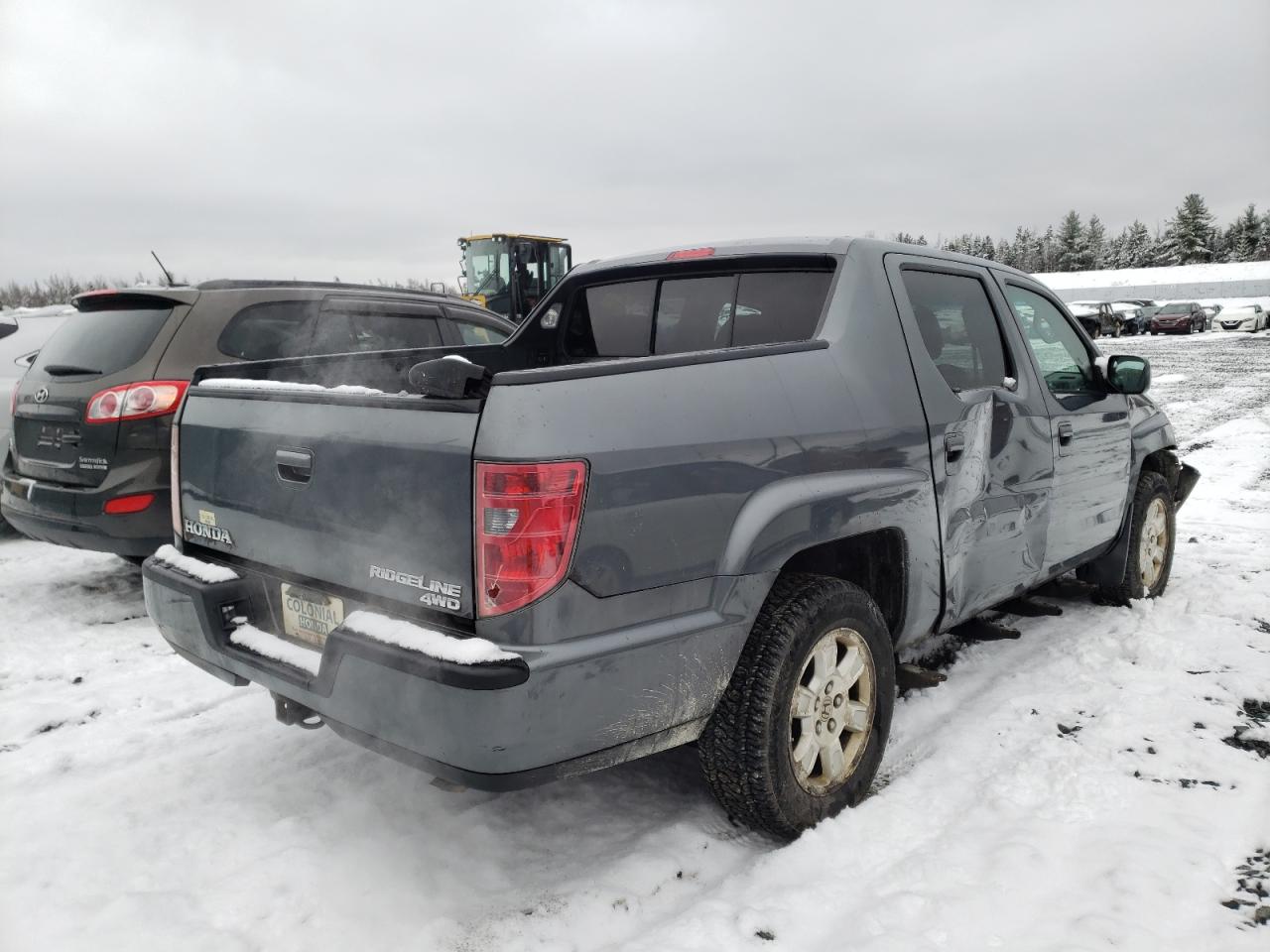 Photo 17 from auction – 2010 HONDA RIDGELINE with VIN 5FPYK1F50AB504290
