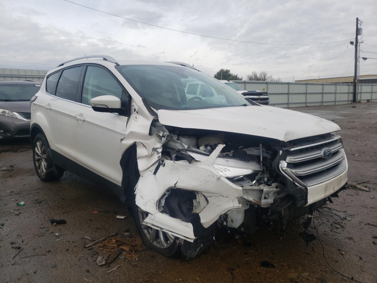 FORD ESCAPE TIT 2017 with VIN 1FMCU9JD9HUC89547 - Photo from auction