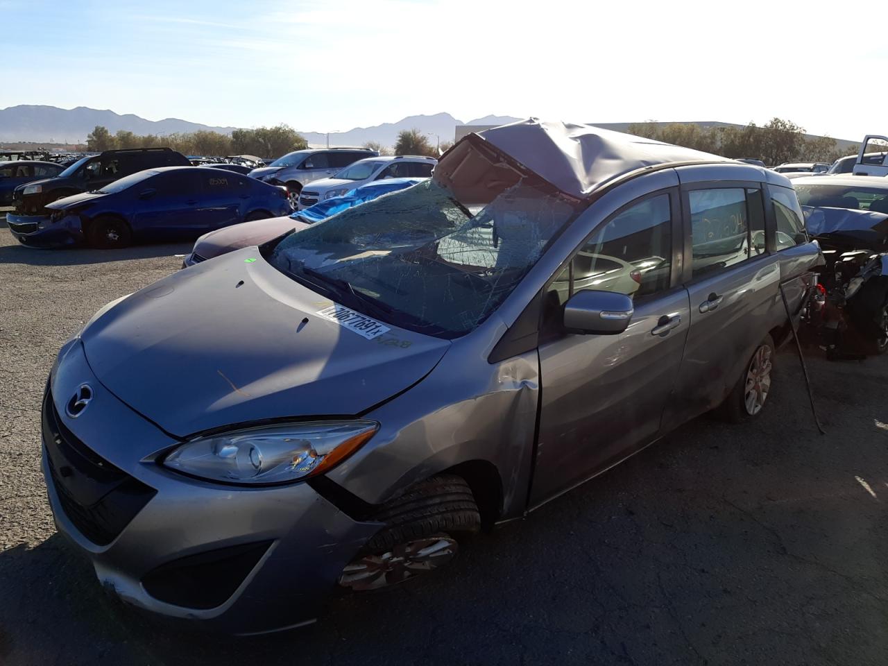 Photo 2 from auction – 2015 MAZDA 5 SPORT with VIN JM1CW2BLXF0185407