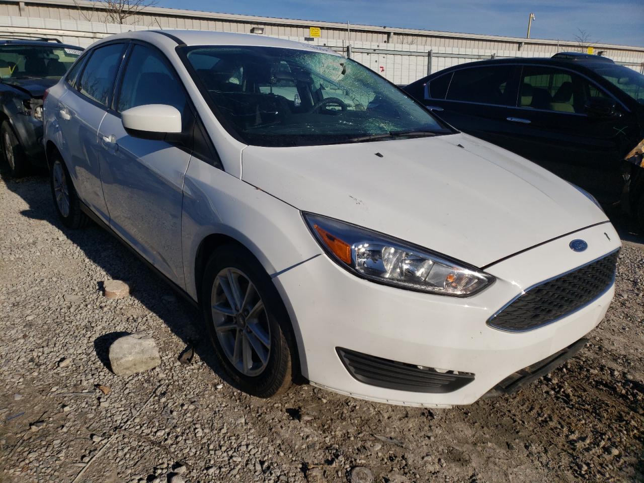 FORD FOCUS SE 2018 with VIN 1FADP3F21JL301583 - Photo from auction