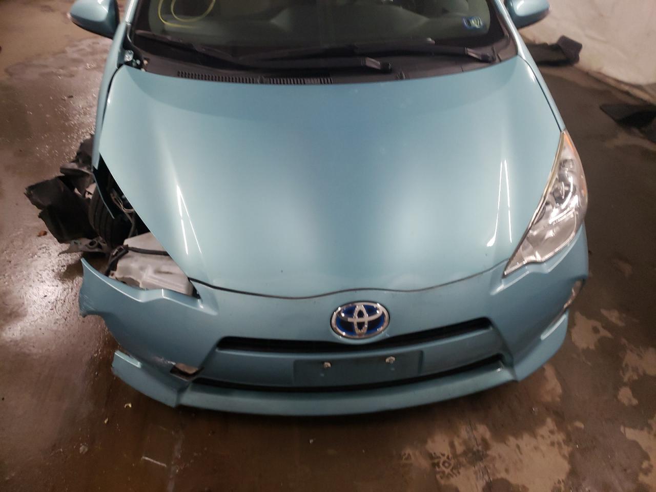 Photo 7 from auction – 2014 TOYOTA PRIUS C with VIN JTDKDTB3XE1072850