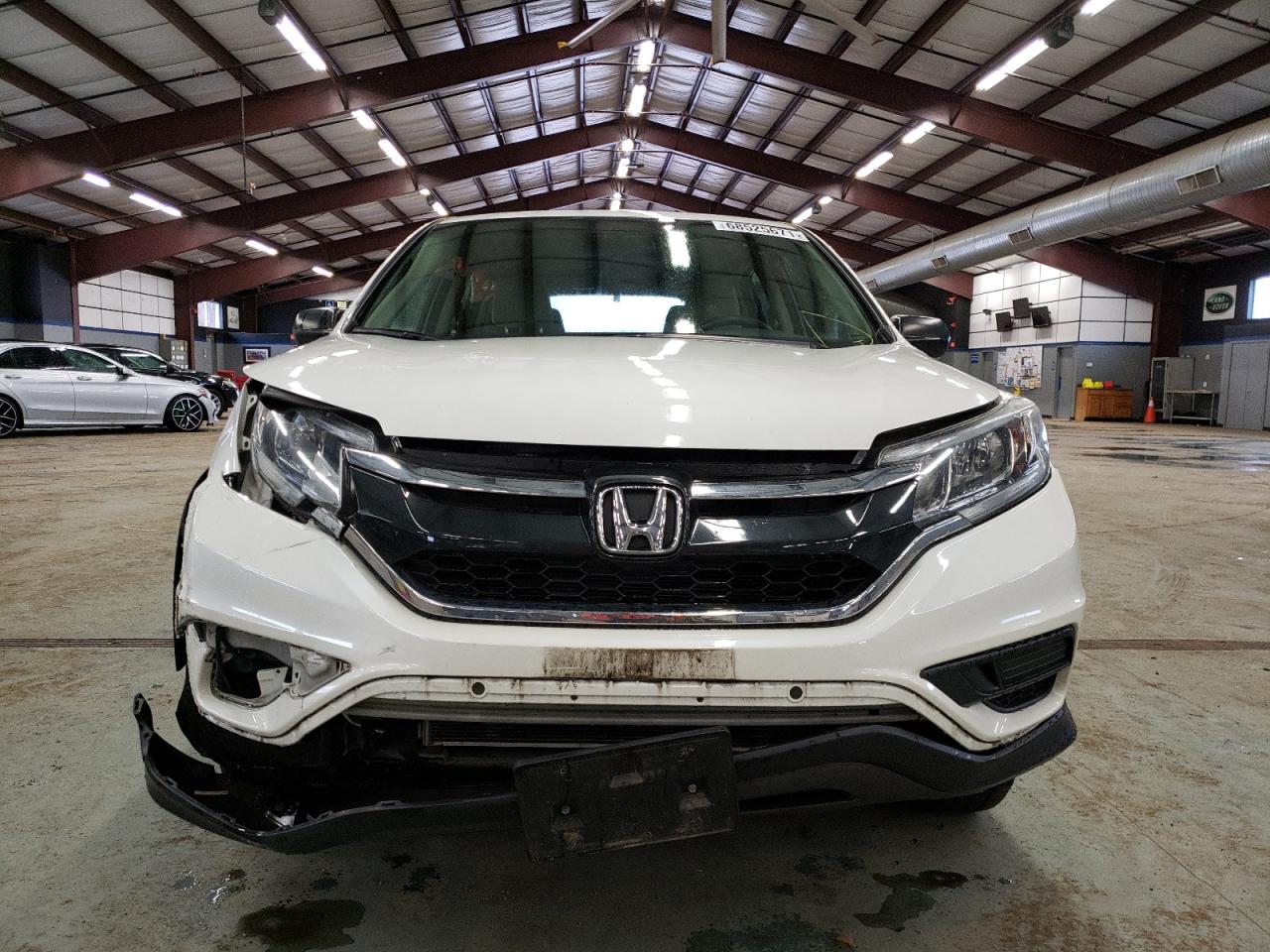 Photo 9 from auction – 2015 HONDA CR-V LX with VIN 5J6RM4H33FL117980