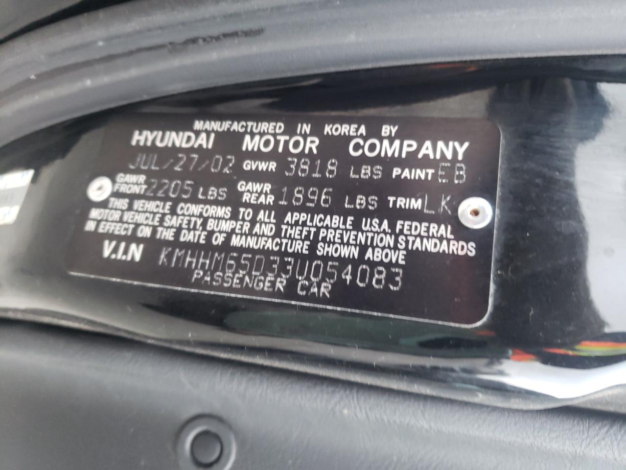 Photo 10 from auction – 2003 HYUNDAI TIBURON with VIN KMHHM65D33U054083