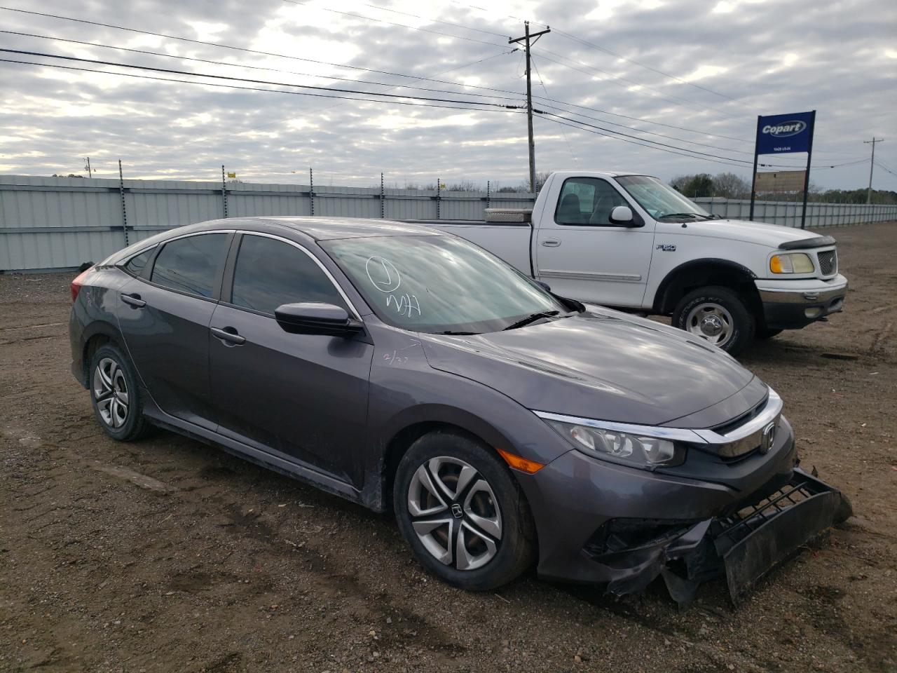 HONDA CIVIC LX 2017 with VIN 19XFC2F54HE023669 - Photo from auction