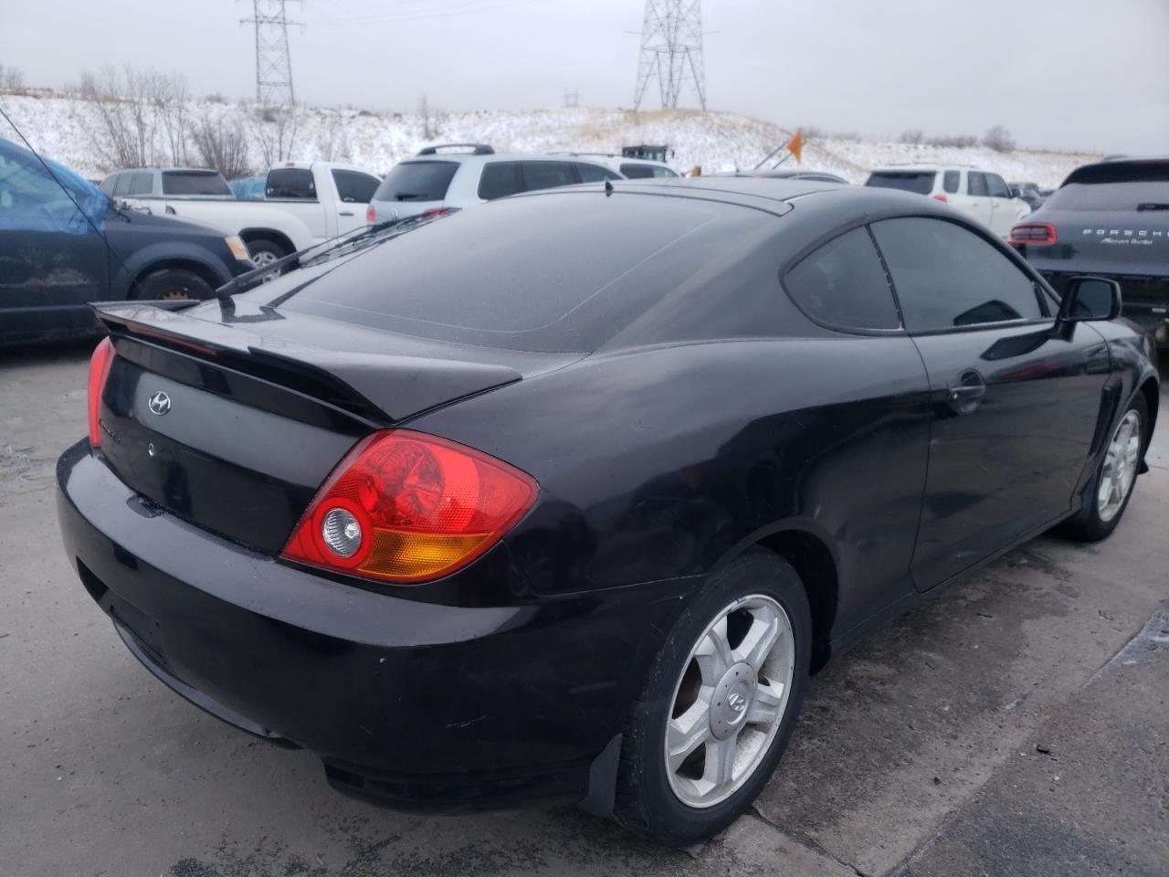 Photo 4 from auction – 2003 HYUNDAI TIBURON with VIN KMHHM65D33U054083