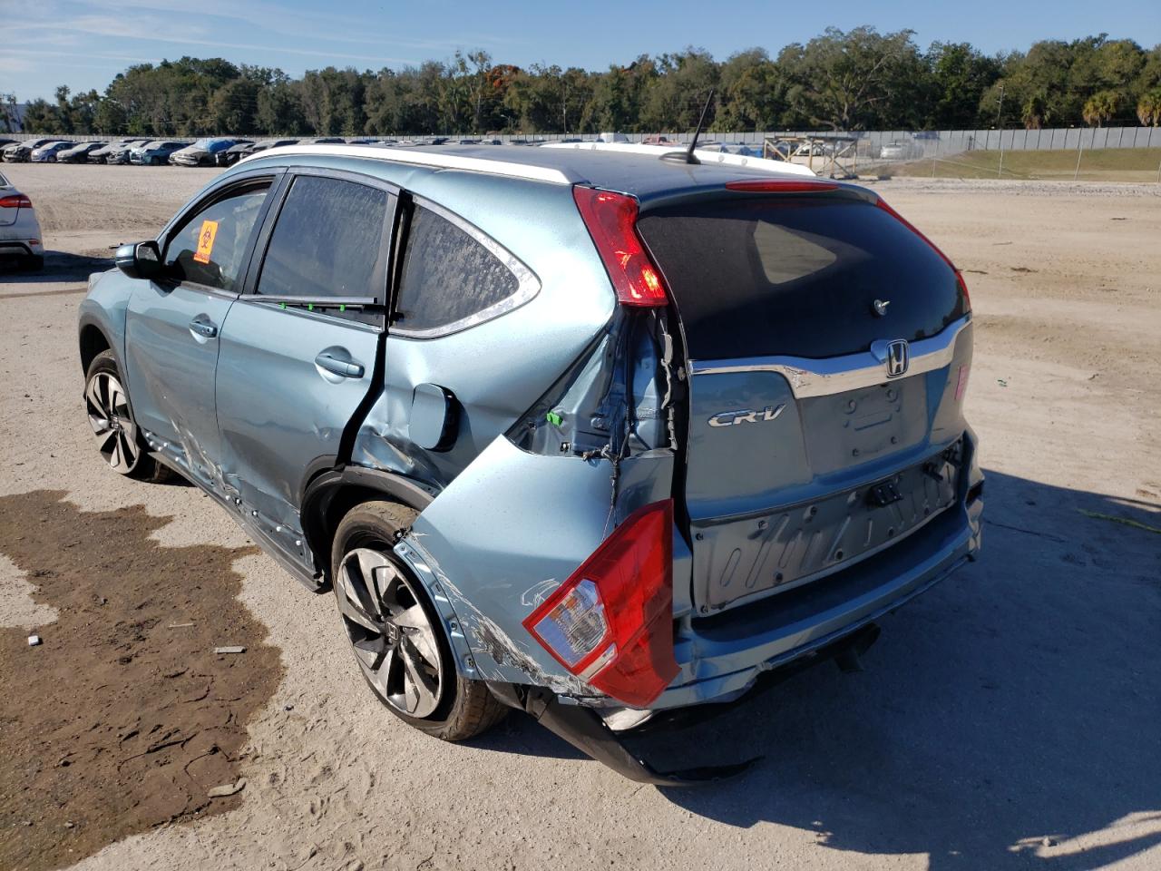 Photo 3 from auction – 2015 HONDA CR-V TOURI with VIN 5J6RM3H95FL024179