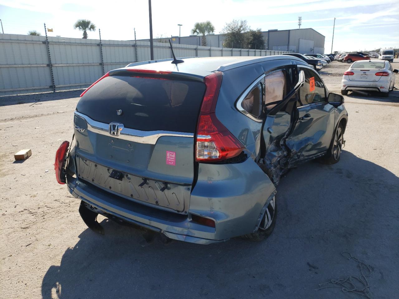 Photo 4 from auction – 2015 HONDA CR-V TOURI with VIN 5J6RM3H95FL024179