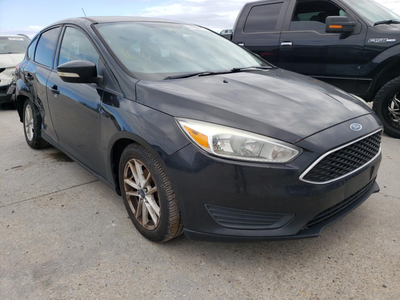 FORD FOCUS SE 2015 with VIN 1FADP3K21FL329560 - Photo from auction