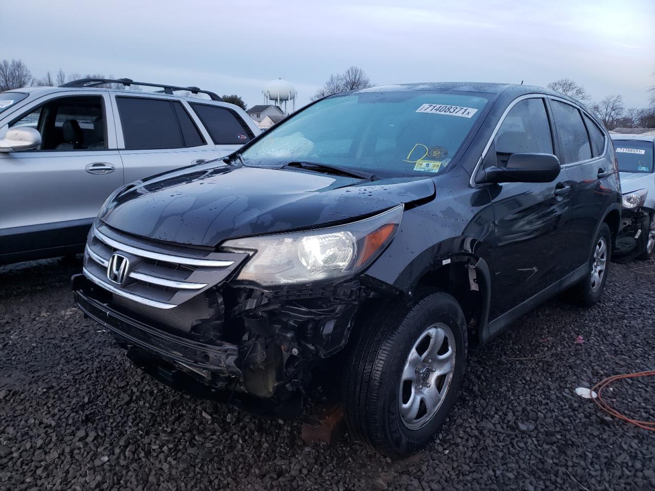 Photo 2 from auction – 2014 HONDA CR-V LX with VIN 2HKRM4H38EH710470