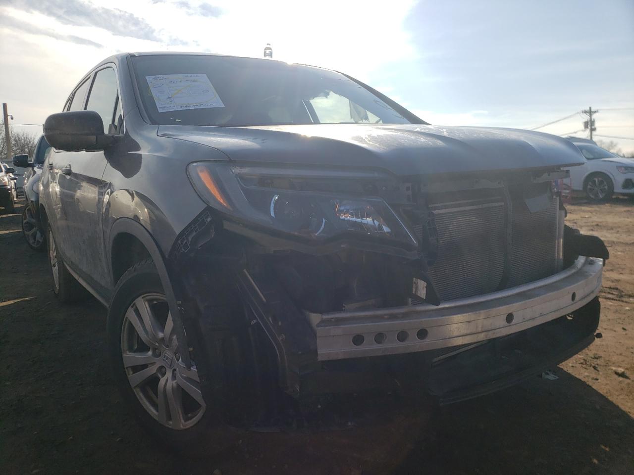 HONDA PILOT LX 2017 with VIN 5FNYF6H10HB066000 - Photo from auction
