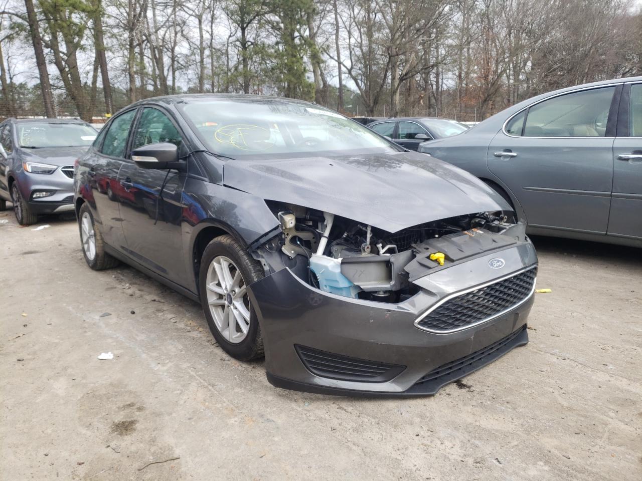 FORD FOCUS SE 2017 with VIN 1FADP3F21HL300427 - Photo from auction