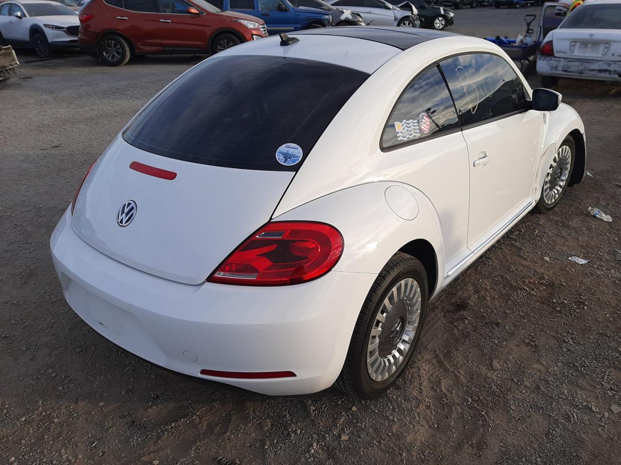Photo 4 from auction – 2013 VOLKSWAGEN BEETLE with VIN 3VWJP7AT0DM672268