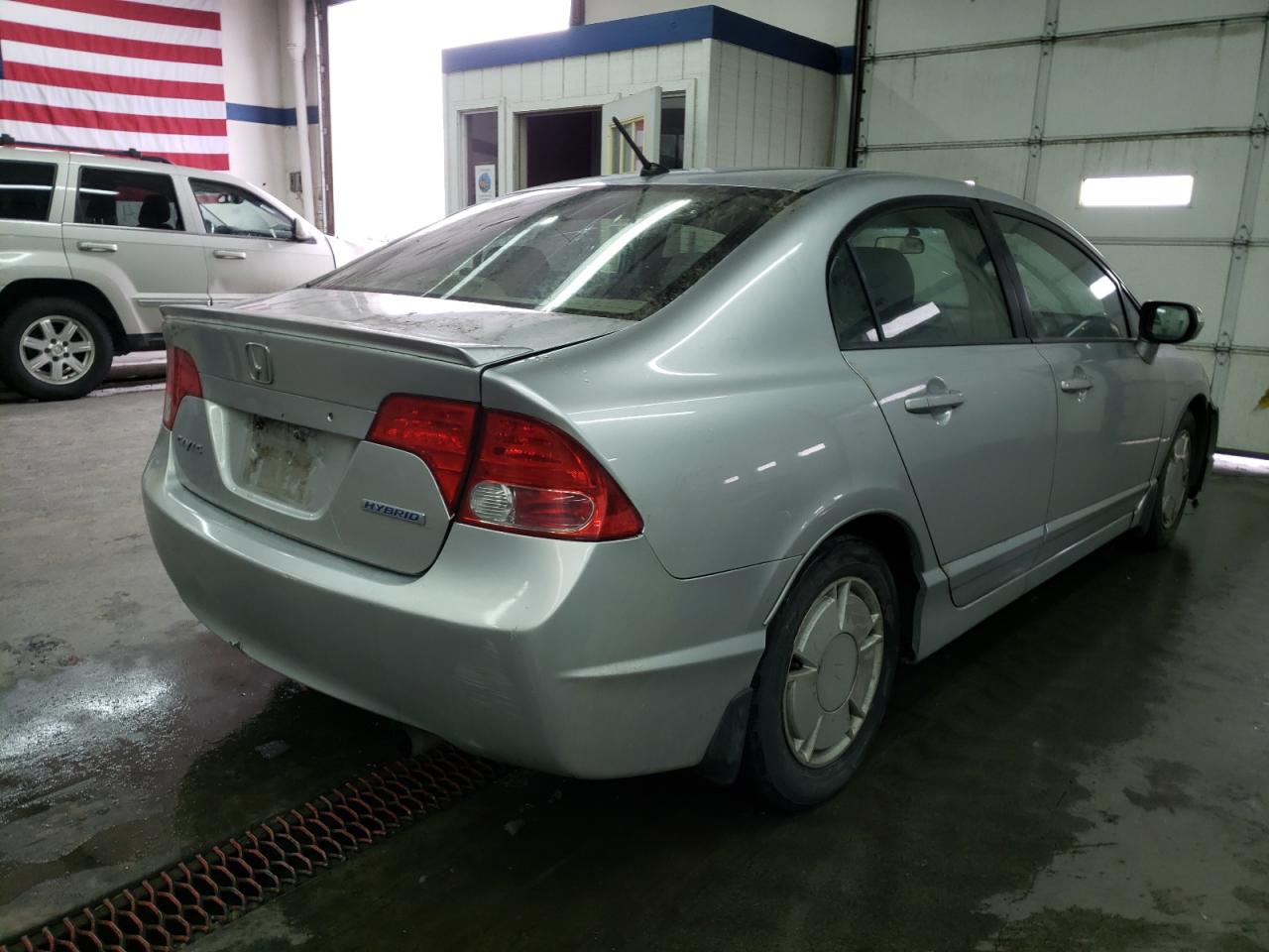 Photo 4 from auction – 2007 HONDA CIVIC HYBR with VIN JHMFA36237S026946