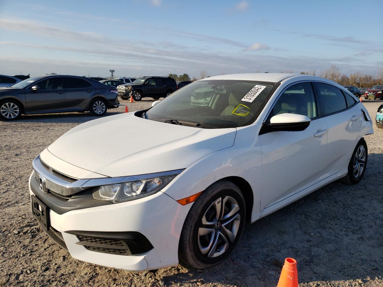 Photo 2 from auction – 2018 HONDA CIVIC LX with VIN 2HGFC2F54JH504971