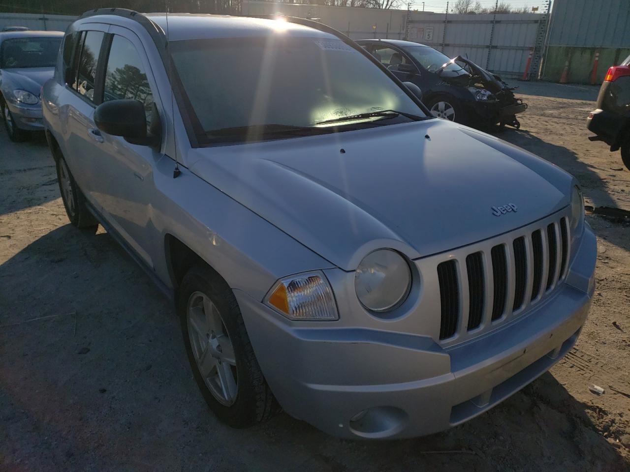 JEEP COMPASS SP 2010 with VIN 1J4NT1FA8AD646975 - Photo from auction