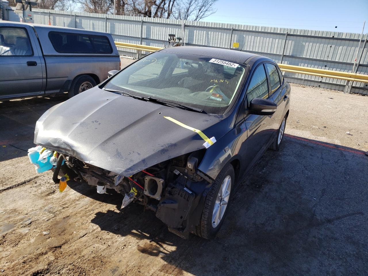 Photo 2 from auction – 2016 FORD FOCUS SE with VIN 1FADP3F21GL355555
