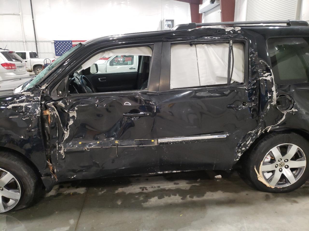 Photo 9 from auction – 2015 HONDA PILOT TOUR with VIN 5FNYF4H95FB062743