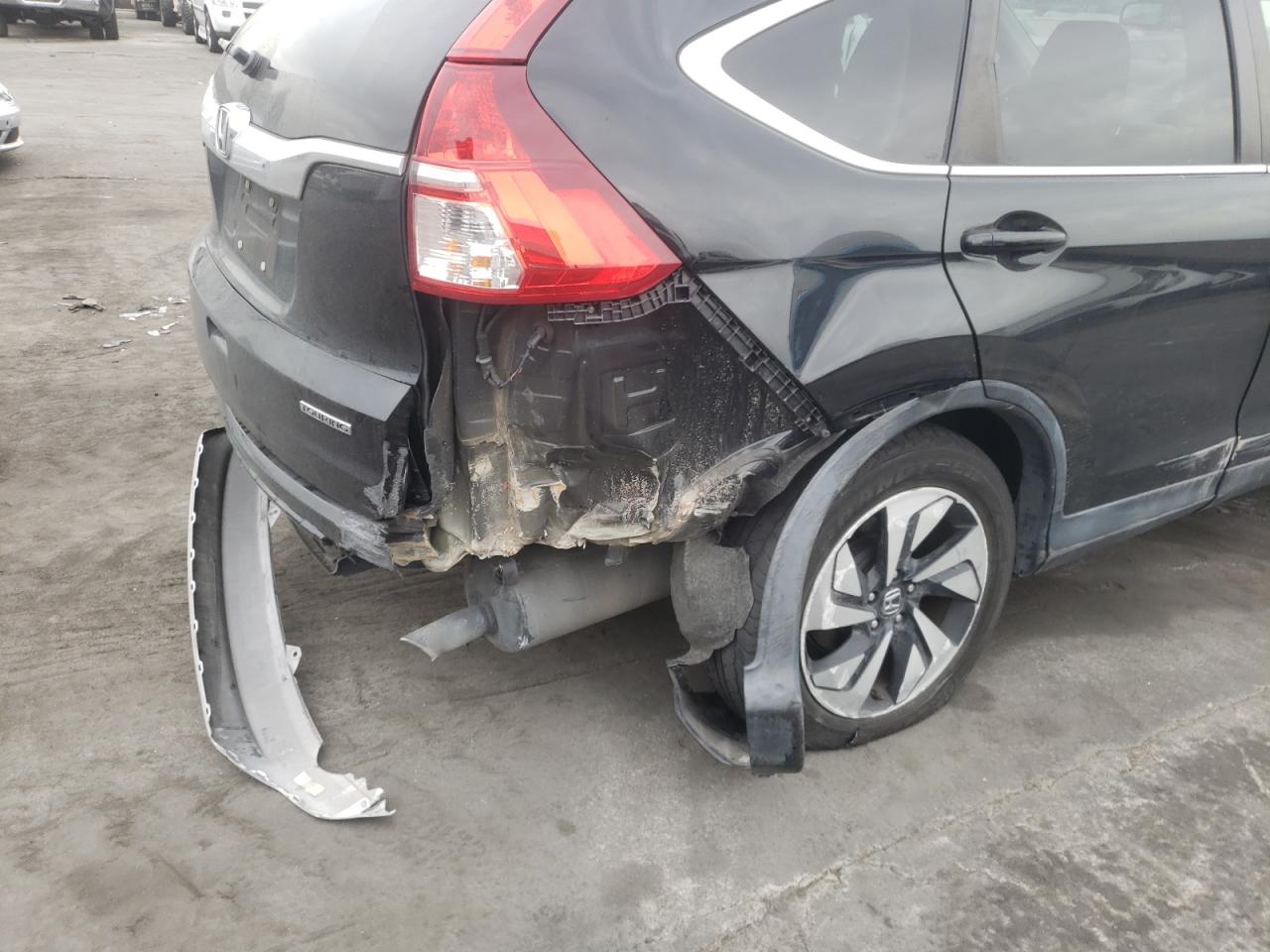 Photo 9 from auction – 2015 HONDA CR-V TOURI with VIN 5J6RM3H93FL021121