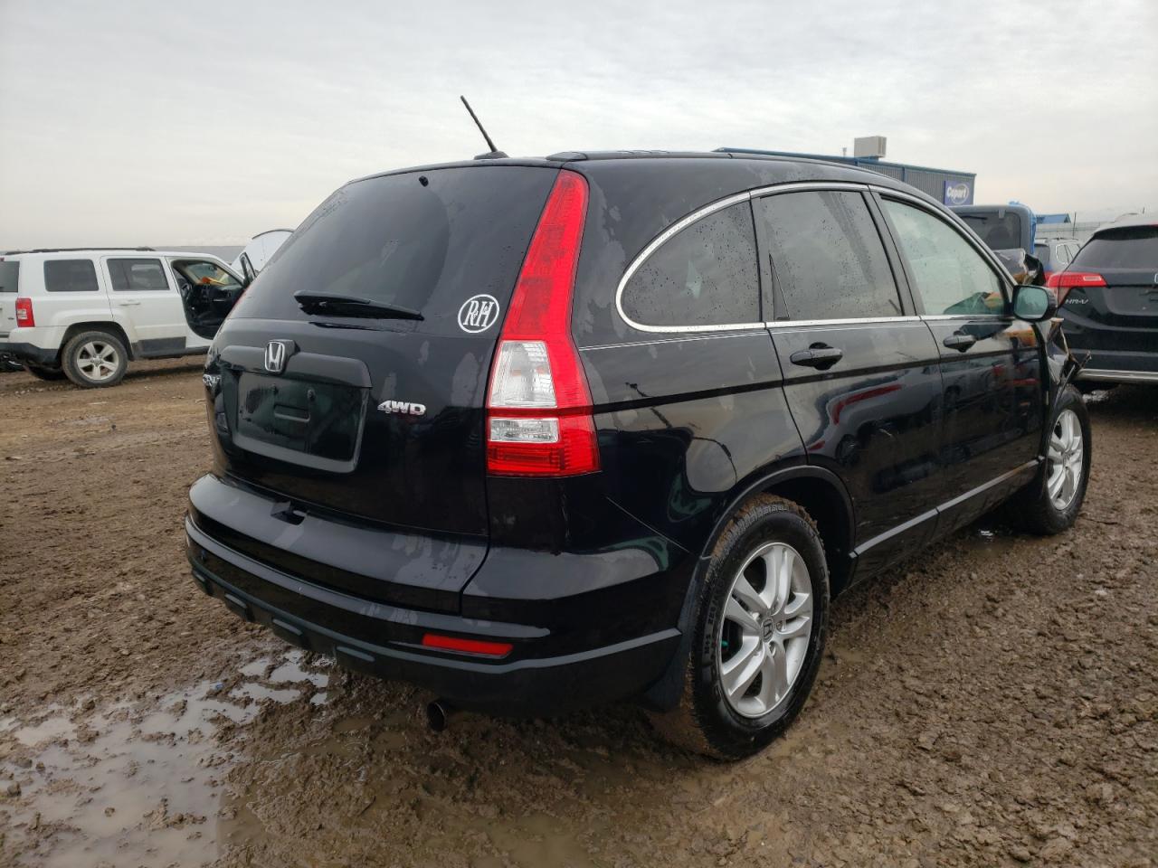 Photo 4 from auction – 2011 HONDA CR-V EXL with VIN 5J6RE4H71BL063458