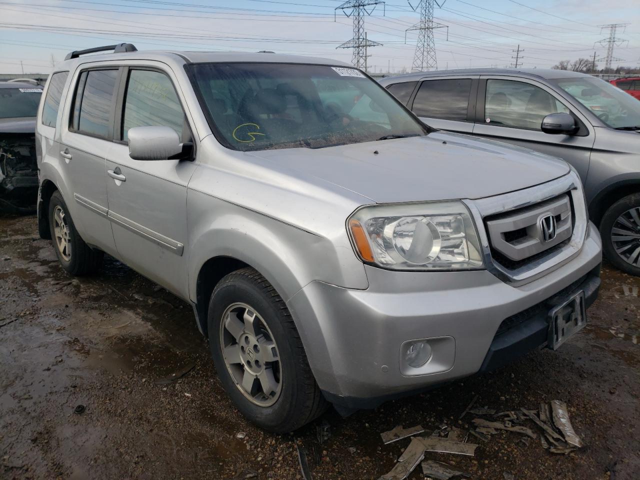HONDA PILOT TOUR 2011 with VIN 5FNYF4H91BB029328 - Photo from auction