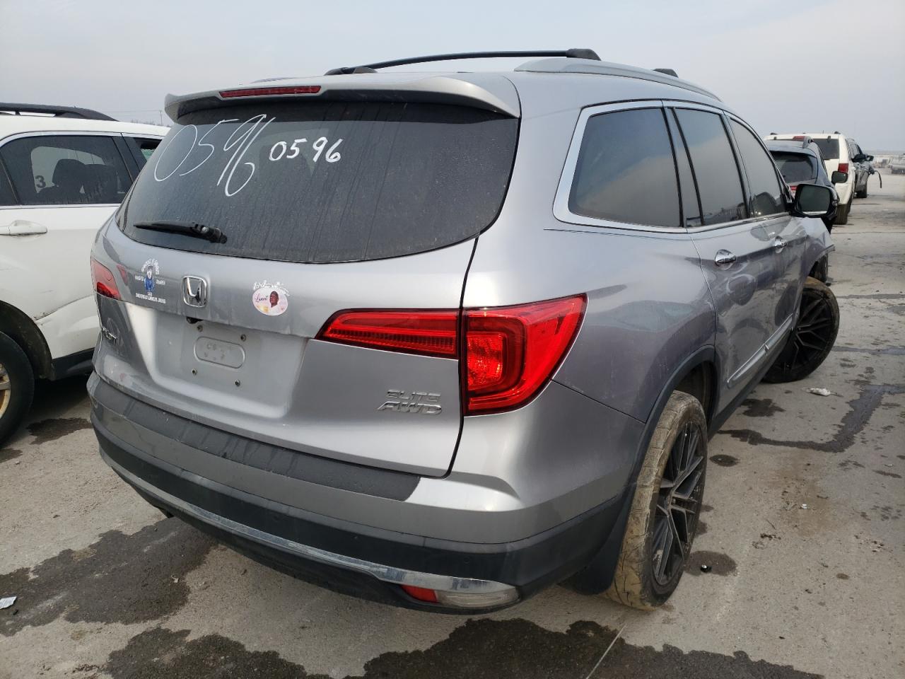 Foto 4 de la subasta – 2016 HONDA PILOT ELIT con VIN 5FNYF6H04GB050596