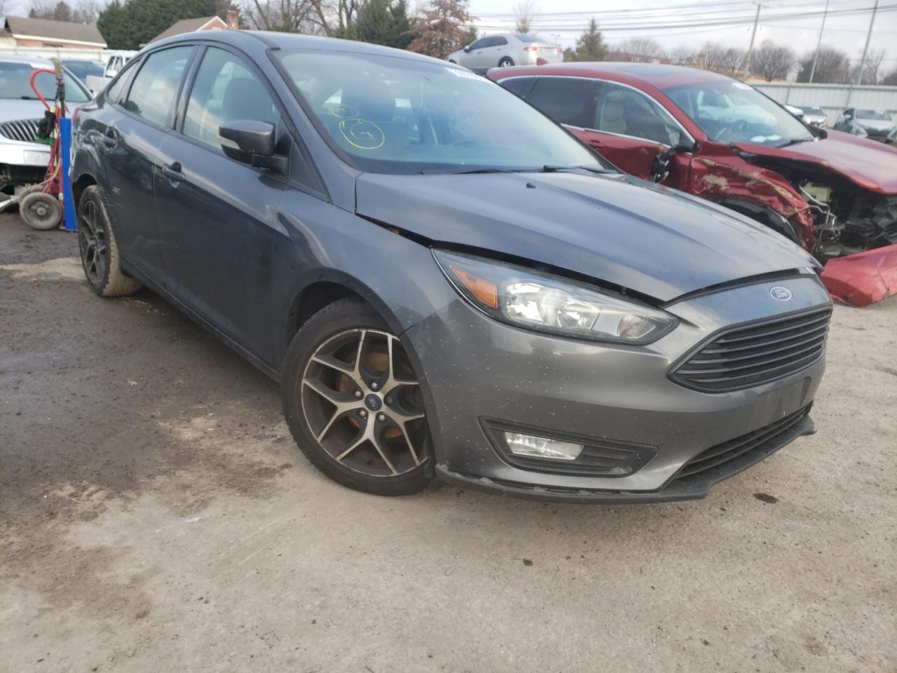 FORD FOCUS SE 2017 with VIN 1FADP3FE5HL275252 - Photo from auction