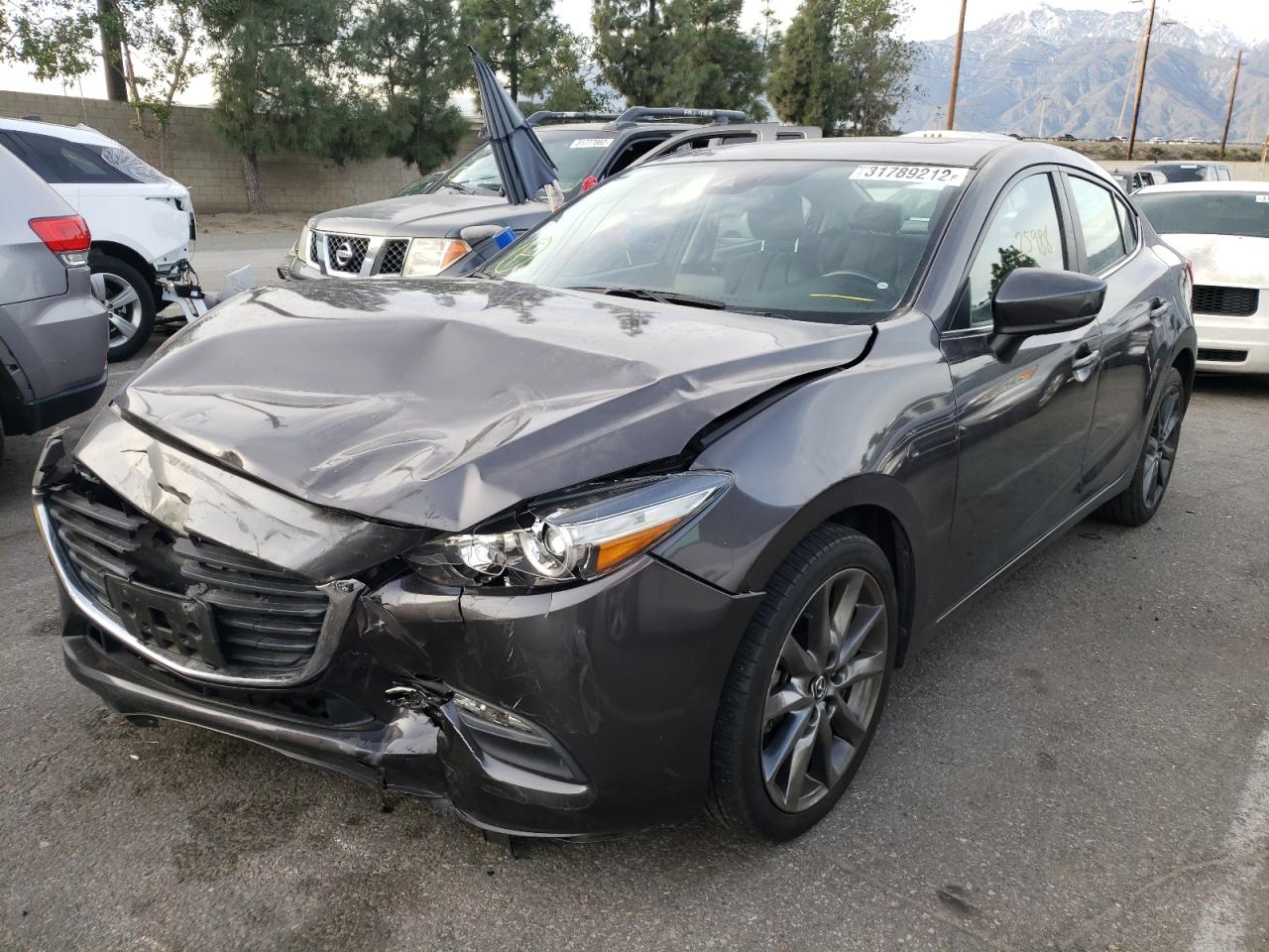 Photo 2 from auction – 2018 MAZDA 3 TOURING with VIN 3MZBN1V39JM187057