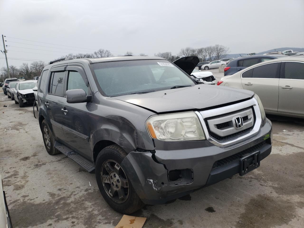HONDA PILOT TOUR 2011 with VIN 5FNYF4H91BB086063 - Photo from auction