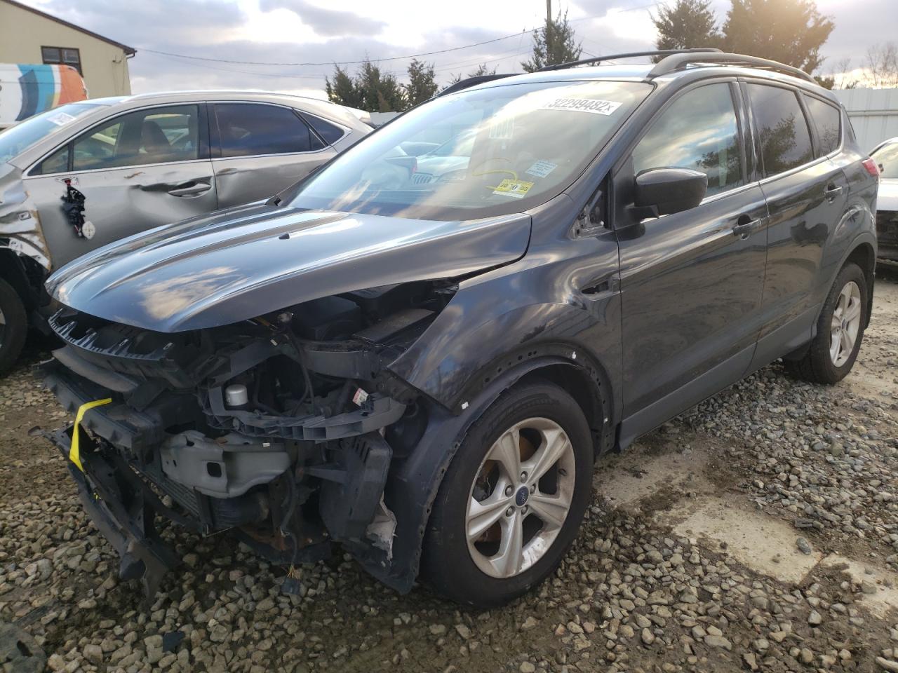 Photo 2 from auction – 2015 FORD ESCAPE SE with VIN 1FMCU9G98FUA30032