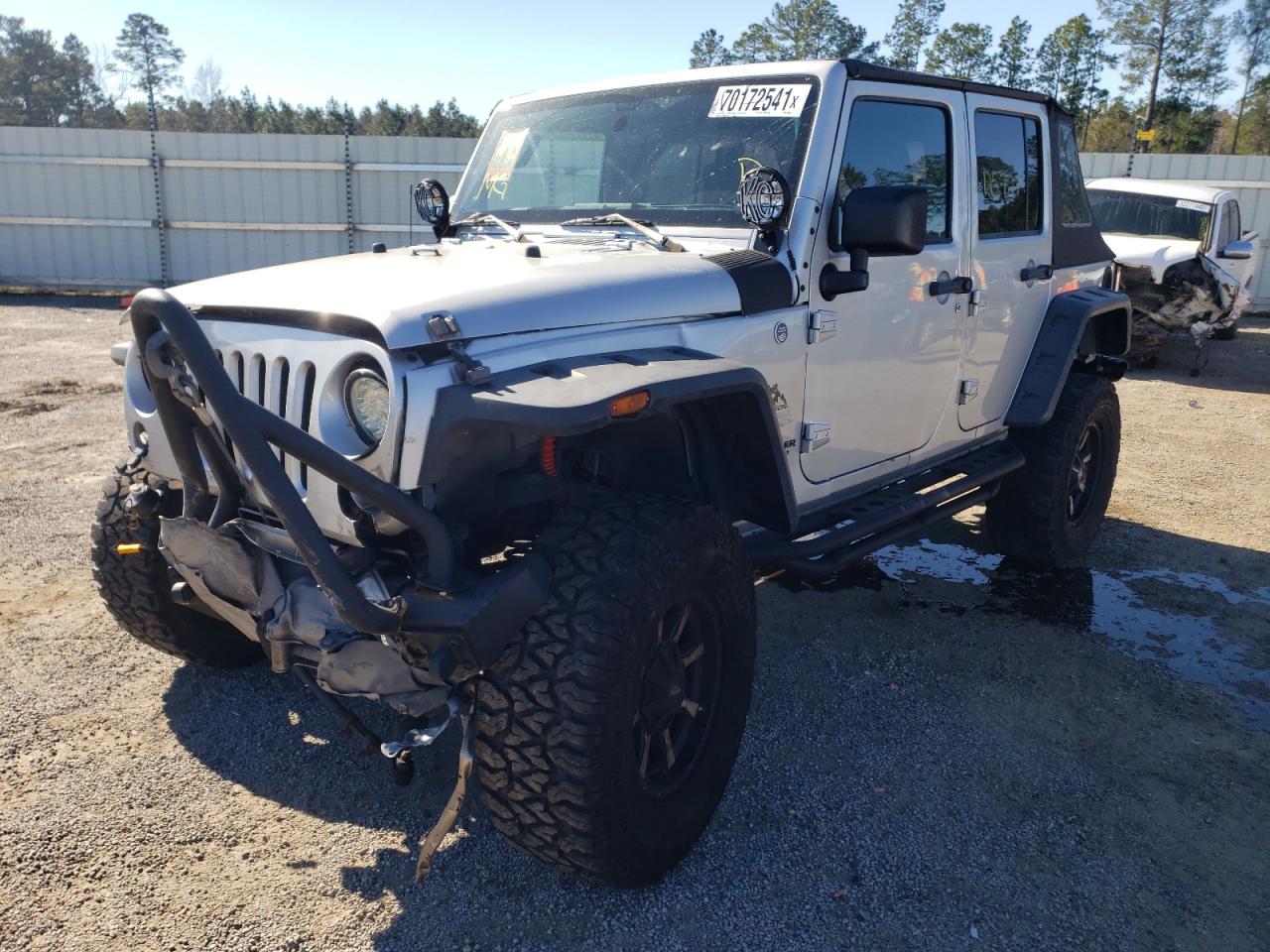 Photo 2 from auction – 2011 JEEP WRANGLER U with VIN 1J4BA5H10BL568633