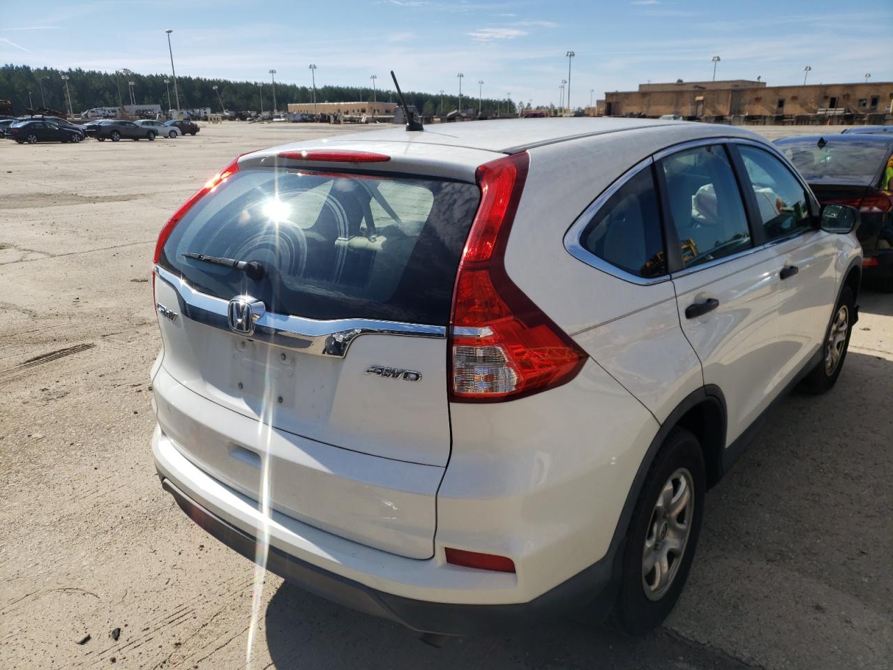 Photo 4 from auction – 2015 HONDA CR-V LX with VIN 5J6RM4H35FL049116