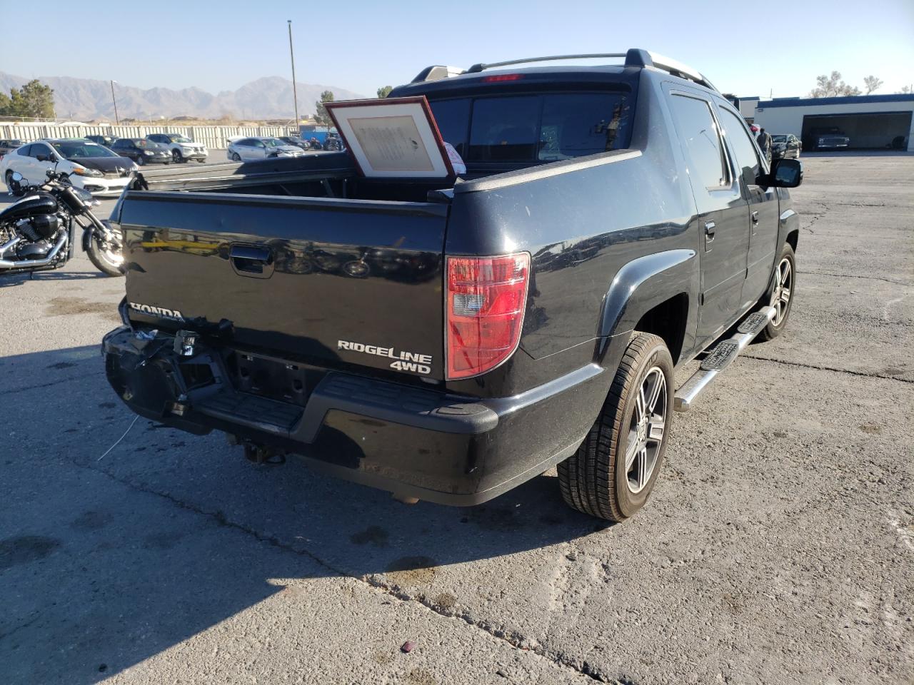 Photo 4 from auction – 2011 HONDA RIDGELINE with VIN 5FPYK1F58BB452781