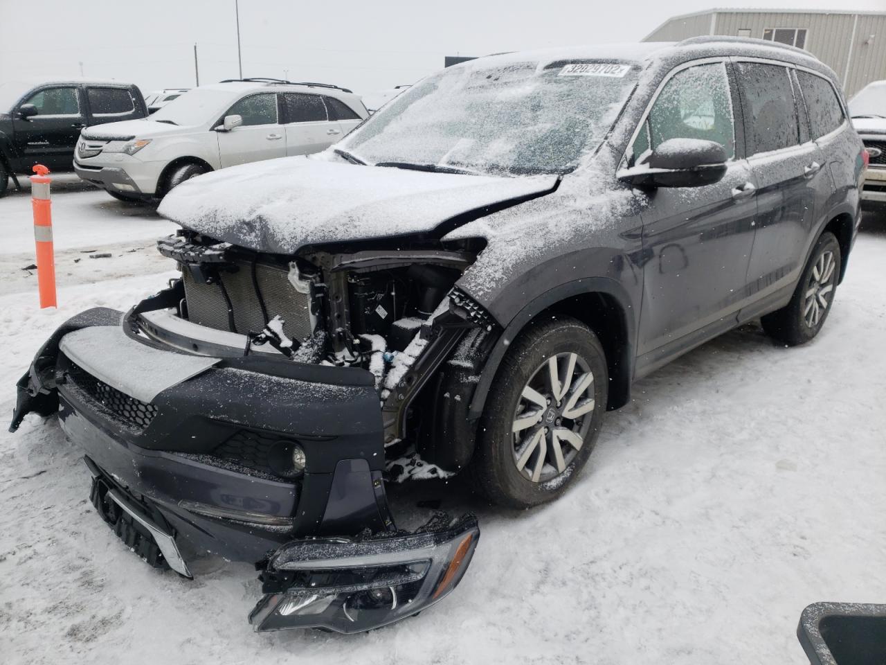 Photo 2 from auction – 2021 HONDA PILOT BLAC with VIN 5FNYF6H79MB506438