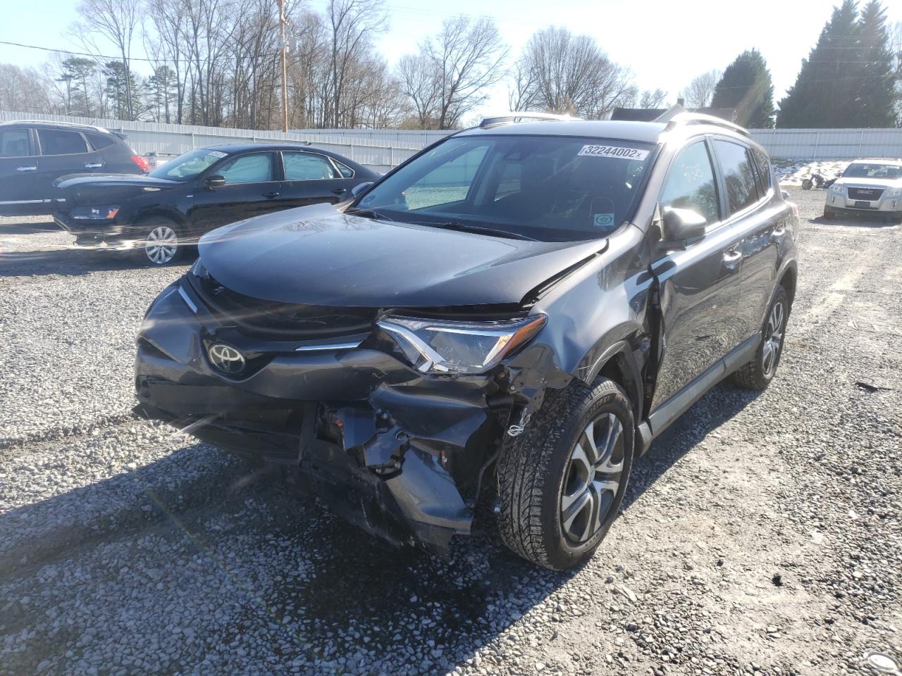 Photo 2 from auction – 2018 TOYOTA RAV4 LE with VIN 2T3ZFREVXJW452419